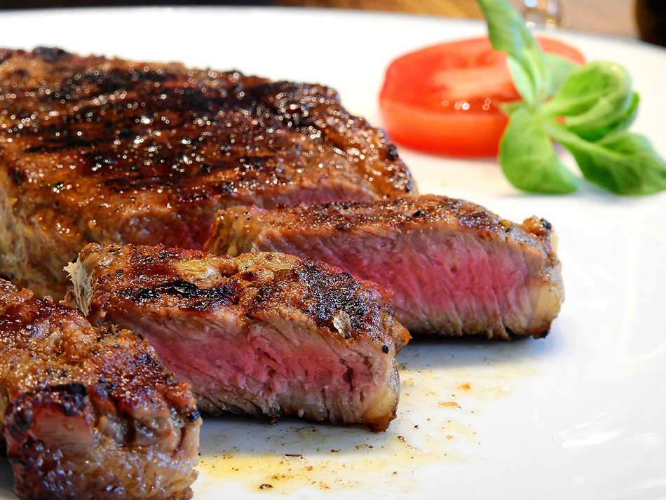 plate with steak and tomato slice